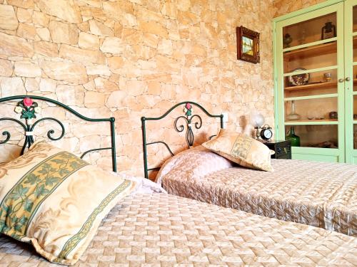 מיטה או מיטות בחדר ב-Casa Flor do Mar Lagos