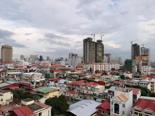 a view of a city with many buildings and skyscrapers at A1 Hotel in Phnom Penh