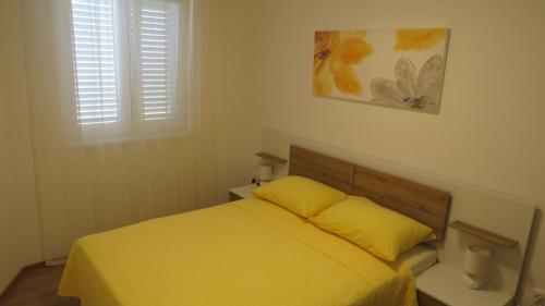 Postel nebo postele na pokoji v ubytování Apartments LUCIA