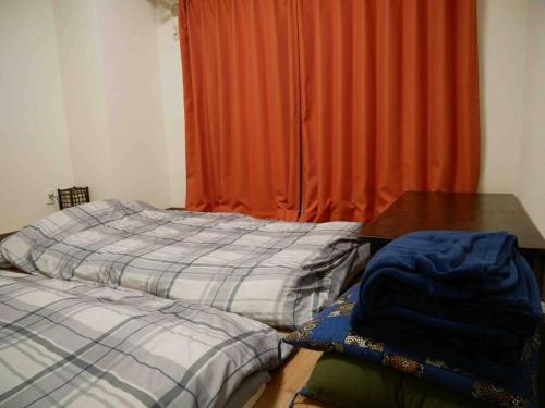Een bed of bedden in een kamer bij Shingetsukan#605
