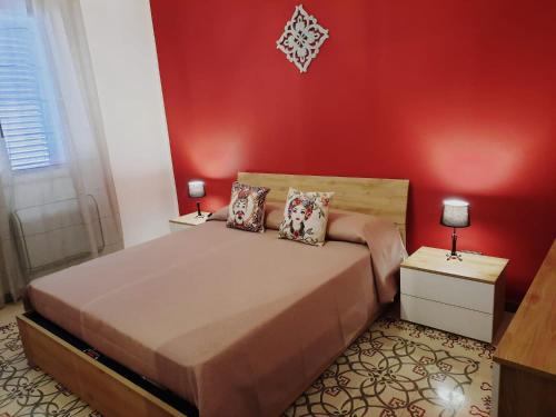 En eller flere senger på et rom på La Sicilia in casa