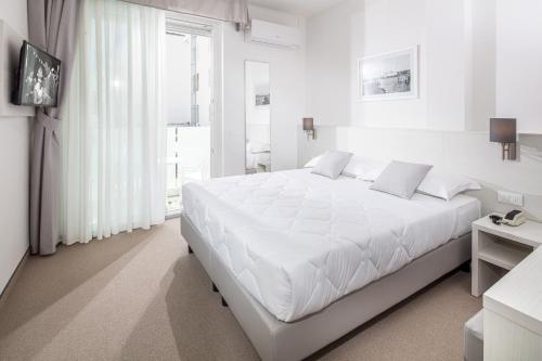 Postel nebo postele na pokoji v ubytování Hotel Centrale