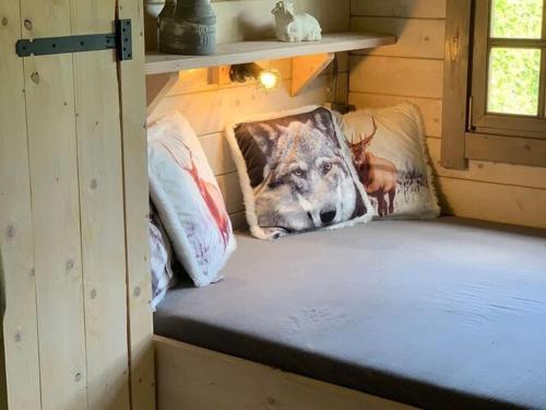 a room with pillows on the floor of a cabin at Atmospheric chalet with a spacious garden, in Friesland in Tzummarum