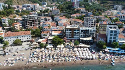 an aerial view of a beach with umbrellas at Apartments Djuro Rafailovic in Budva