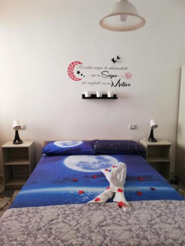 a childs bedroom with a bed with a mouse on it at GIADA MARIA SOLE HOUSE in Pulsano