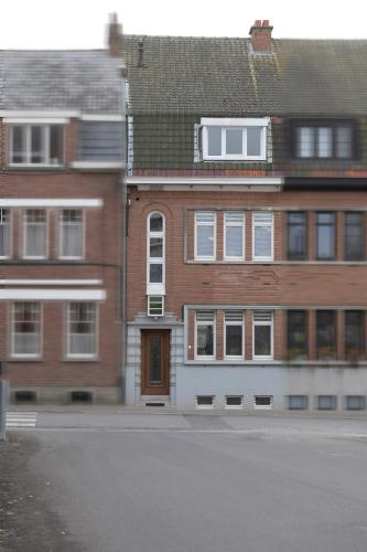 a group of buildings on a city street at Gastenkamers huYze K in Zottegem