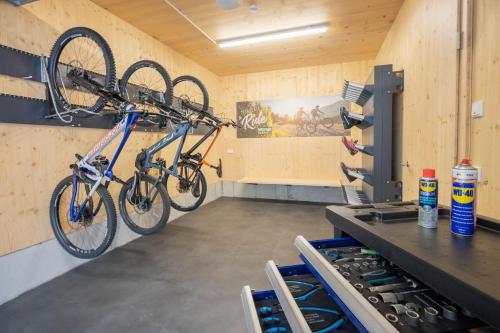 two bikes hanging on a wall in a room at Haus Amatschon in Brand