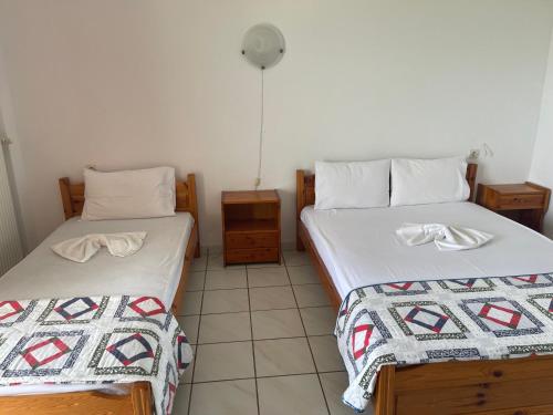 Postel nebo postele na pokoji v ubytování Tsolakis Apartments