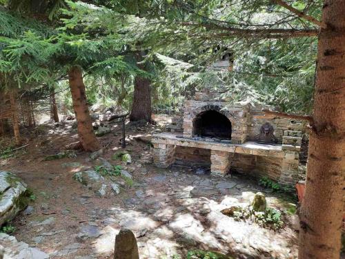 a stone oven in the middle of a forest at Lusi Holiday, Смолянски езера in Smolyan