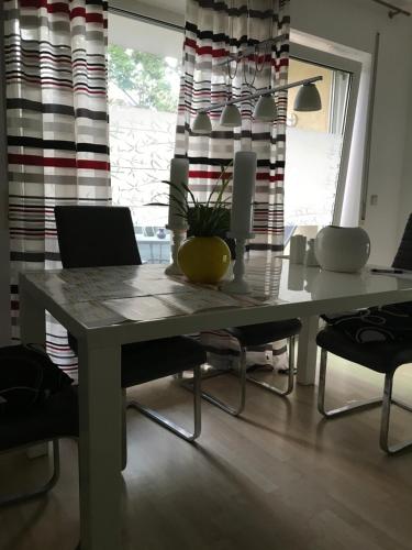 a table with a laptop on it in a room at Student Homestay in Im Teller