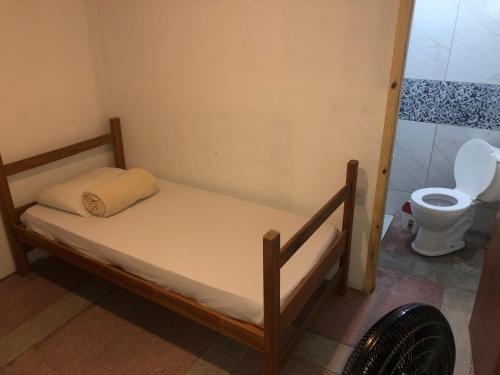 מיטה או מיטות בחדר ב-Hotel Casa Branca