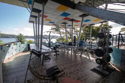 a gym with a view of the water at Boca Brava Lodge in Boca Chica