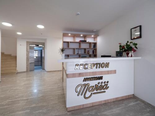 an office with a reception counter in a lobby at Marea Apartments Budva in Budva