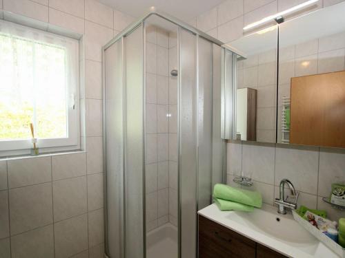 a bathroom with a shower and a sink at Modern Apartment in Hochgallmigg with Balcony in Hochgallmig