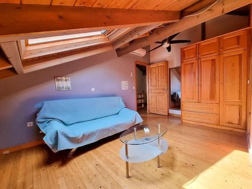 a bedroom with a bed and a table in a room at Artemis House in Agios Georgios Pagon