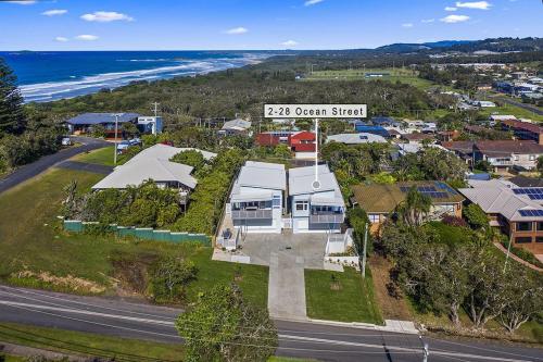 an aerial view of a house with a street at Bluehaven Woolgoolga - Brand New, Ocean Views, 200m Stroll to Beach and Restaurants! in Woolgoolga
