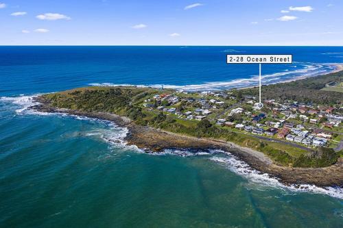 an aerial view of an island in the ocean at Bluehaven Woolgoolga - Brand New, Ocean Views, 200m Stroll to Beach and Restaurants! in Woolgoolga