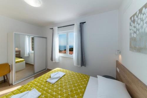 Posteľ alebo postele v izbe v ubytovaní Apartment MARE