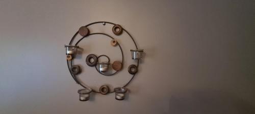 a mirror with a stethoscope on a wall at L'Antre Parenthèse de Sainte-Cécile in Florenville