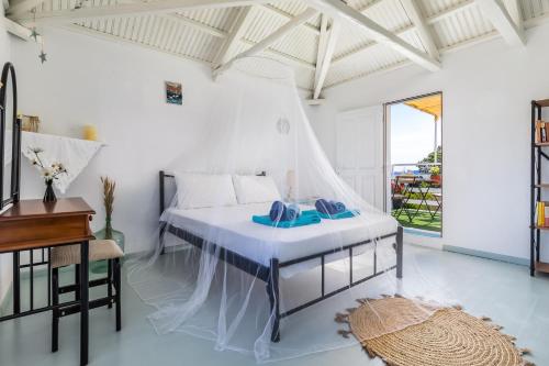 Postel nebo postele na pokoji v ubytování Pastalia Cottage