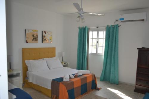 Un pat sau paturi într-o cameră la Pai Pajarito