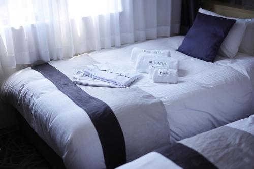 ホテルアクテル名古屋錦にあるベッド
