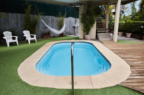 a swimming pool in the middle of a yard at Hotel Termas Day in Termas del Daymán