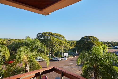 a view of a street with cars parked on the road at Hotel Termas Day in Termas del Daymán
