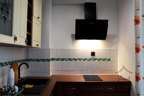 Η κουζίνα ή μικρή κουζίνα στο Lyck Apartamenty