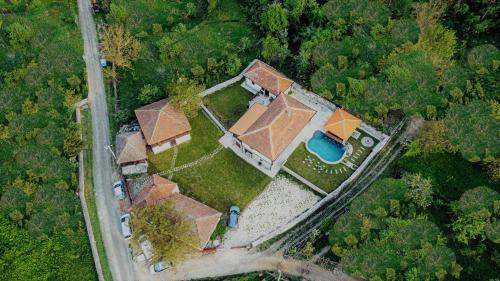an overhead view of a house in the forest at ONOMAD in Boljevac