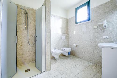 Kupatilo u objektu La Forgia Apartments