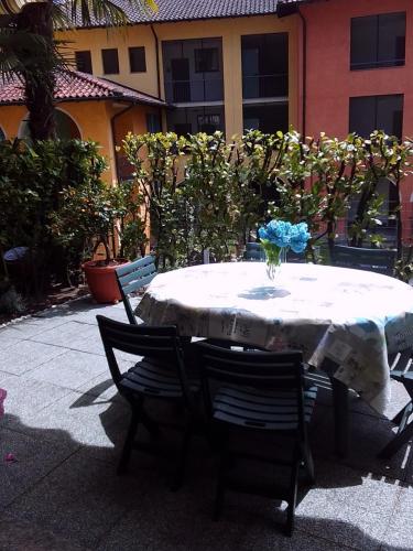 a table with a vase sitting on top of it at Sunshine GuestHouse in Cannero Riviera