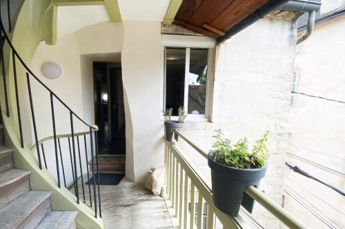 a cat sitting on the stairs of a house at Wood Stone and Wine in Beaune