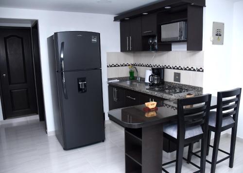Virtuvė arba virtuvėlė apgyvendinimo įstaigoje AROMA CAFÉ IV