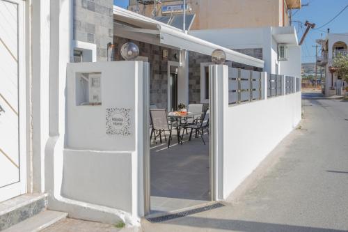 a white refrigerator on the side of a building at Nicolas Home in Ierapetra