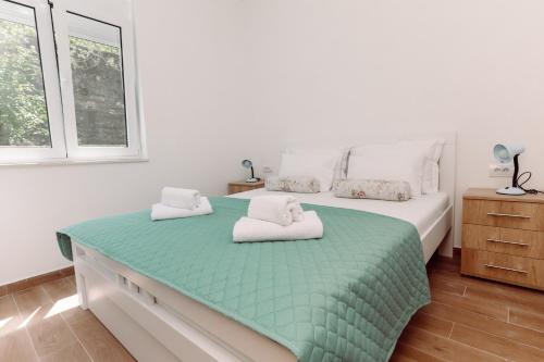 Ένα ή περισσότερα κρεβάτια σε δωμάτιο στο Waterfront Apartment Petrovina
