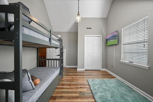 a bedroom with a bunk bed and a hallway at Private Mountain Cabin, hot tub escape in the Smokies, with THE view in Sevierville