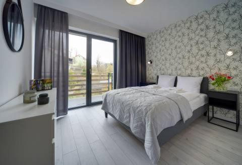Posteľ alebo postele v izbe v ubytovaní Apart Invest Centum Park 21
