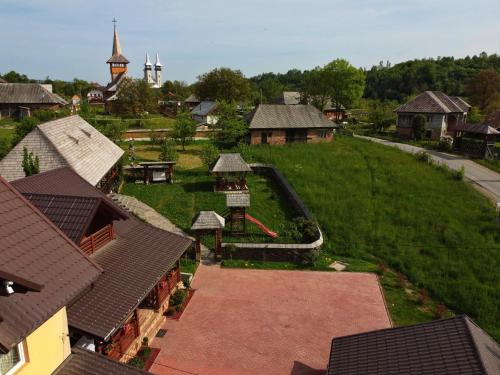 an aerial view of a small village with houses at Pensiunea Inima Maramureșului in Breb