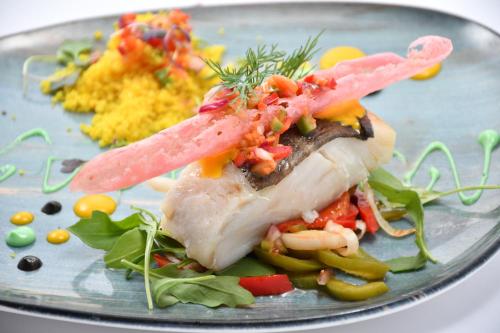 a plate of food with meat and vegetables on it at HB Torrevieja in Torrevieja