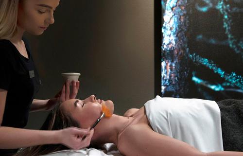 a woman giving a woman a donut in her mouth at Norefjell Ski & Spa in Noresund