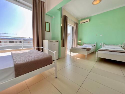 Postel nebo postele na pokoji v ubytování Archontiki City Hotel