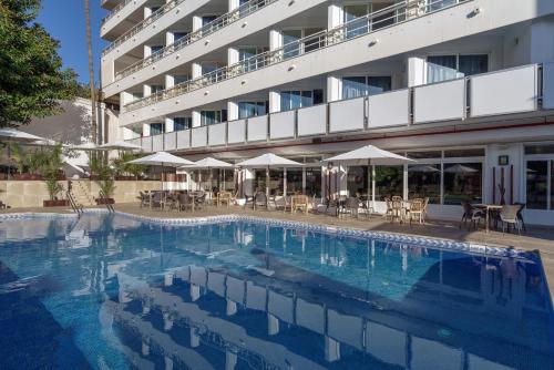 a large swimming pool in front of a hotel at Hotel Costa Málaga - Adults Recommended - by Pierre & Vacances in Torremolinos