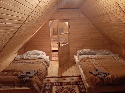 Una cama o camas en una habitación de Cabana Mos
