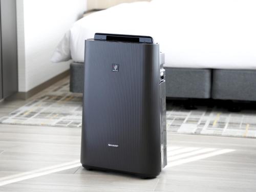 a black refrigerator sitting on the floor in a room at Hyatt Place Kyoto in Kyoto