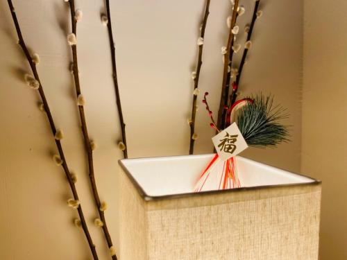 a wooden box with a star on top of it at 捉鳳凰 台南百年老宅包棟導覽民宿系列Catchphoenix Centennial Guesthouse in Tainan