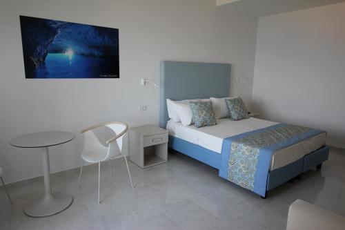 Ένα ή περισσότερα κρεβάτια σε δωμάτιο στο Hotel Lucia