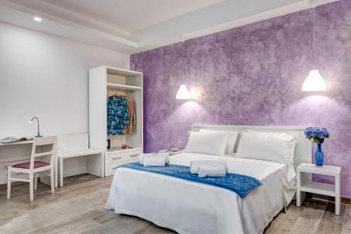 Posteľ alebo postele v izbe v ubytovaní GOCCE VILLAS - Dimoria Aster Apartment