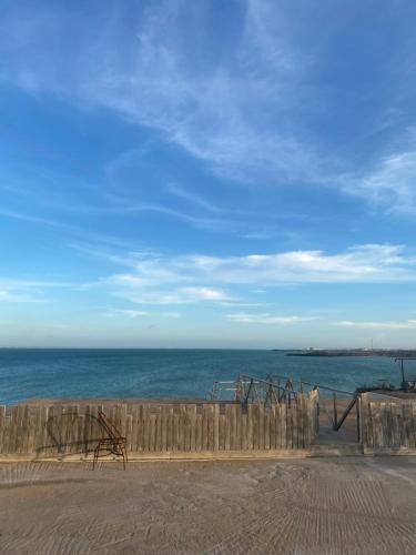 a playground on the beach with the ocean in the background at Hotel Dakhla Ville in Dakhla