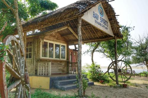a small wooden house with a sign on it at Lotus an Eco Resort Konark in Konārka